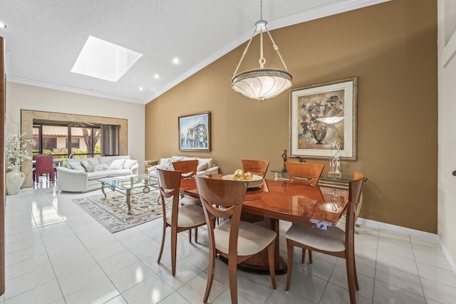 6067 Kings Gate Cir, Delray Beach, FL 33484 - dining space with vaulted ceiling, a skylight, crown molding, light tile patterned floors, and recessed lighting