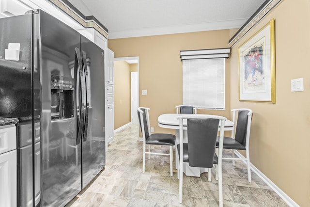 6067 Kings Gate Cir, Delray Beach, FL 33484 - dining area with crown molding and baseboards