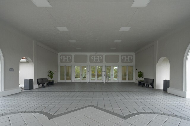 6067 Kings Gate Cir, Delray Beach, FL 33484 - view of patio featuring french doors