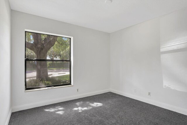 4733 NW 22nd St Unit 4283, Coconut Creek, FL 33063 - empty room featuring carpet and baseboards