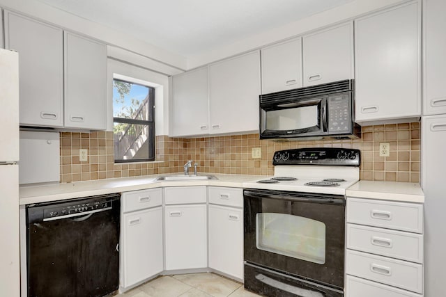 4733 NW 22nd St Unit 4283, Coconut Creek, FL 33063 - kitchen with black appliances, a sink, light countertops, and white cabinetry