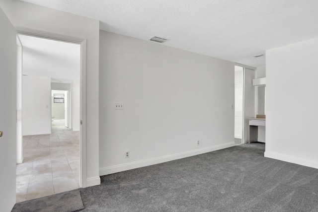 4733 NW 22nd St Unit 4283, Coconut Creek, FL 33063 - carpeted spare room with a textured ceiling and baseboards