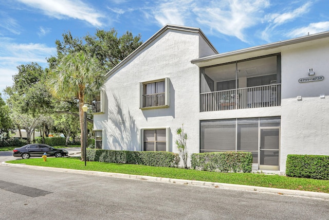 4733 NW 22nd St Unit 4283, Coconut Creek, FL 33063 - view of side of home featuring stucco siding