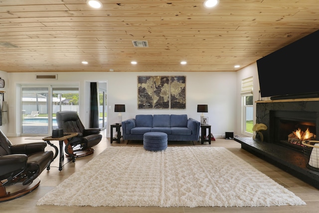 386 NE Ficus Ter, Jensen Beach, FL 34957 - living area with wood ceiling, a stone fireplace, recessed lighting, and wood finished floors