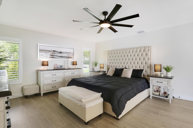 386 NE Ficus Ter, Jensen Beach, FL 34957 - bedroom with light wood-style floors and a ceiling fan