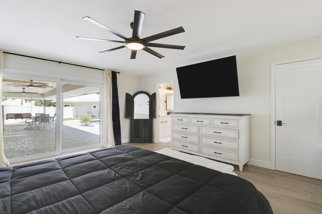 386 NE Ficus Ter, Jensen Beach, FL 34957 - bedroom featuring light wood-type flooring, baseboards, ensuite bathroom, and a ceiling fan
