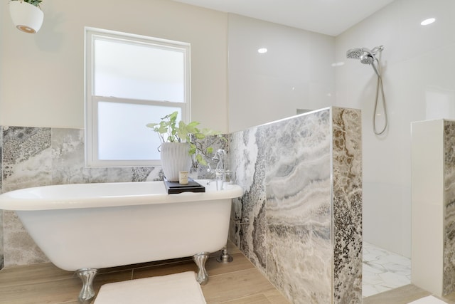 386 NE Ficus Ter, Jensen Beach, FL 34957 - bathroom featuring walk in shower, healthy amount of natural light, and a freestanding bath