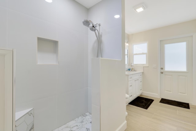 386 NE Ficus Ter, Jensen Beach, FL 34957 - full bath with vanity, a tile shower, and baseboards