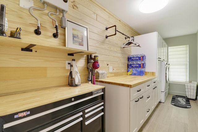 386 NE Ficus Ter, Jensen Beach, FL 34957 - mudroom featuring independent washer and dryer and baseboards