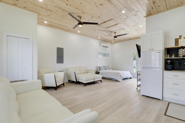 386 NE Ficus Ter, Jensen Beach, FL 34957 - bedroom with wood ceiling, freestanding refrigerator, electric panel, recessed lighting, and light wood-style flooring