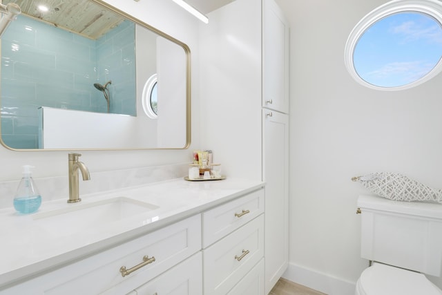 386 NE Ficus Ter, Jensen Beach, FL 34957 - full bath featuring toilet, vanity, and a tile shower