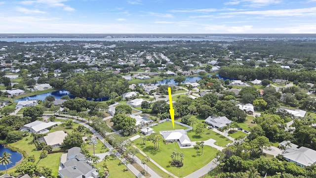 386 NE Ficus Ter, Jensen Beach, FL 34957 - aerial view of residential area featuring a nearby body of water