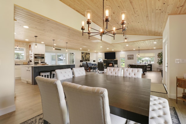 386 NE Ficus Ter, Jensen Beach, FL 34957 - dining room with wood ceiling, recessed lighting, light wood-style flooring, a chandelier, and high vaulted ceiling
