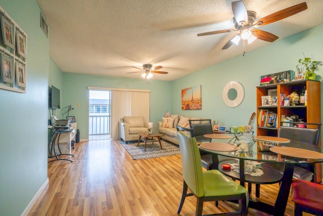 7300 NW 5th Pl Unit 203, Margate, FL 33063 - dining space with ceiling fan, a textured ceiling, wood finished floors, and baseboards