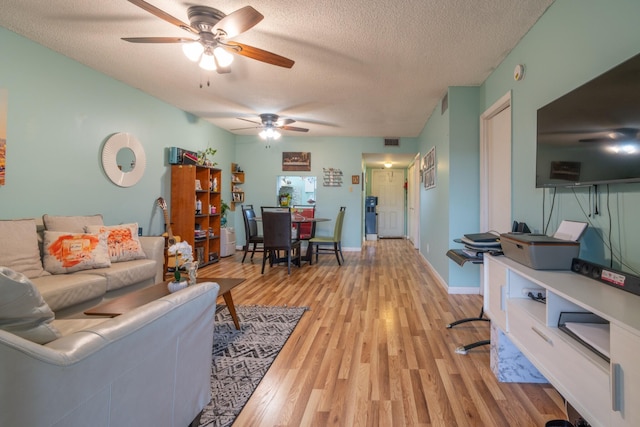7300 NW 5th Pl Unit 203, Margate, FL 33063 - living area with a ceiling fan, light wood-style floors, and a textured ceiling