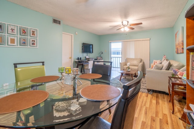 7300 NW 5th Pl Unit 203, Margate, FL 33063 - dining space featuring ceiling fan, wood finished floors, and a textured ceiling