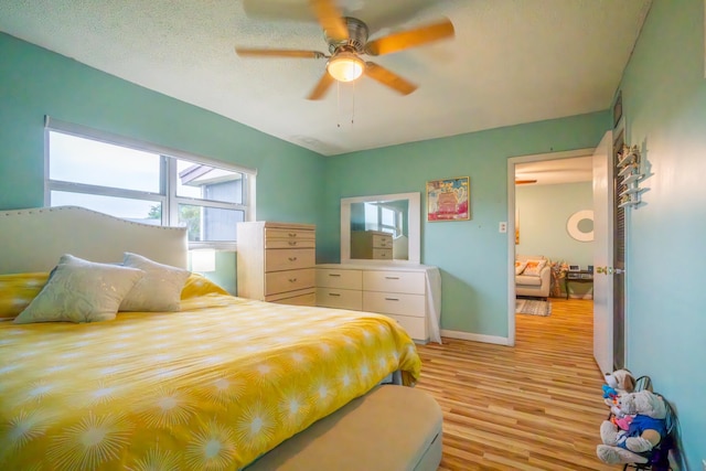 7300 NW 5th Pl Unit 203, Margate, FL 33063 - bedroom with light wood-style floors, baseboards, and a ceiling fan