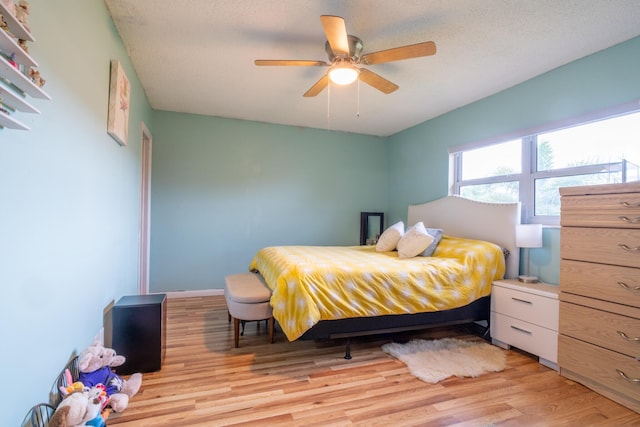 7300 NW 5th Pl Unit 203, Margate, FL 33063 - bedroom featuring light wood-type flooring and a ceiling fan