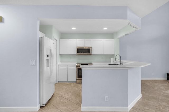 10125 N Military Trl, Palm Beach Gardens, FL 33410 - kitchen featuring appliances with stainless steel finishes, a sink, white cabinetry, light tile patterned floors, and light countertops