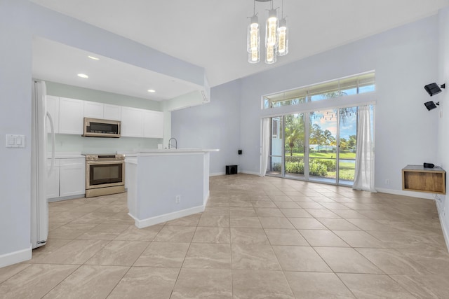 10125 N Military Trl, Palm Beach Gardens, FL 33410 - kitchen featuring appliances with stainless steel finishes, open floor plan, baseboards, light countertops, and a sink