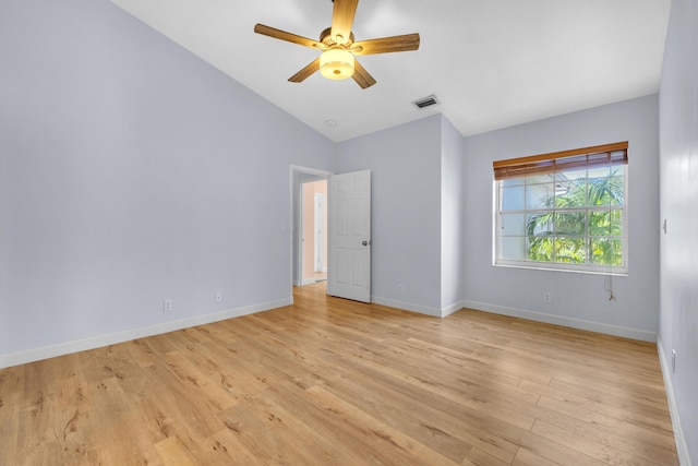 10125 N Military Trl, Palm Beach Gardens, FL 33410 - empty room with vaulted ceiling, light wood-style floors, baseboards, and a ceiling fan