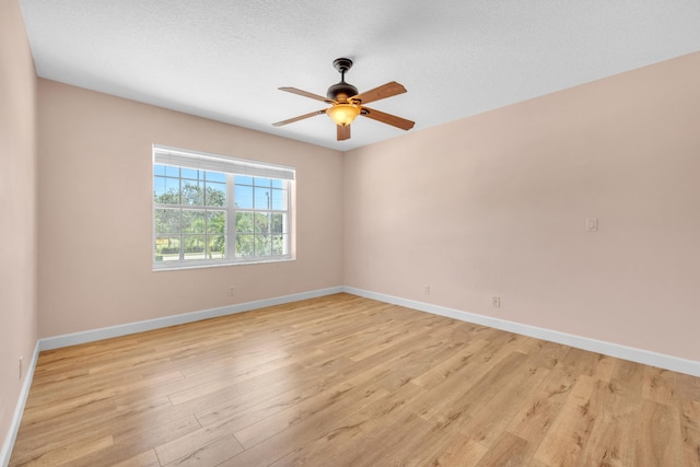 10125 N Military Trl, Palm Beach Gardens, FL 33410 - empty room featuring light wood-style flooring, baseboards, and ceiling fan