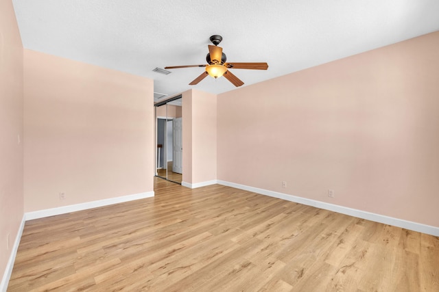10125 N Military Trl, Palm Beach Gardens, FL 33410 - spare room featuring light wood-type flooring, baseboards, and ceiling fan