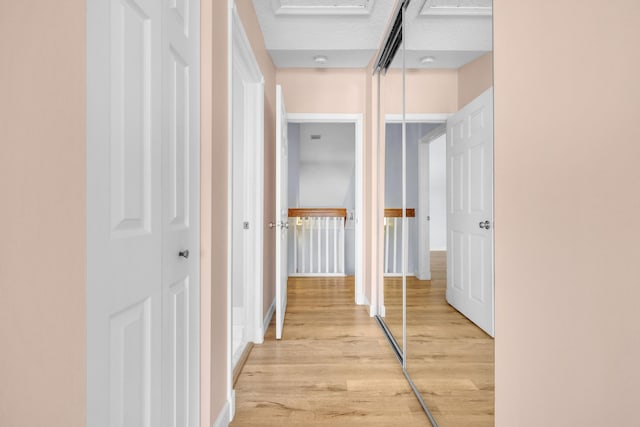 10125 N Military Trl, Palm Beach Gardens, FL 33410 - hallway featuring light wood-type flooring