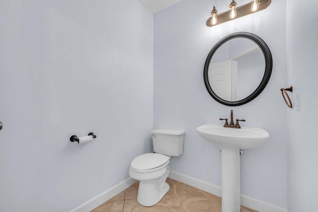 10125 N Military Trl, Palm Beach Gardens, FL 33410 - bathroom featuring toilet, baseboards, and tile patterned floors