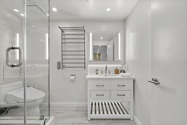 2301 Collins Ave Unit 1239, Miami Beach, FL 33139 - full bath with toilet, vanity, radiator heating unit, baseboards, and recessed lighting