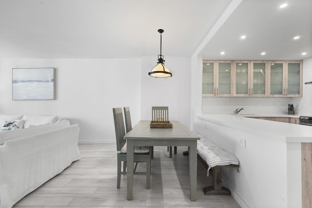 2301 Collins Ave Unit 1239, Miami Beach, FL 33139 - dining room featuring recessed lighting, baseboards, and light wood-style floors