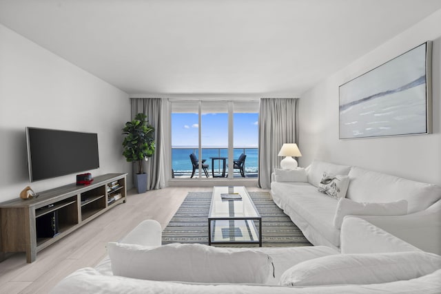 2301 Collins Ave Unit 1239, Miami Beach, FL 33139 - living area with expansive windows and wood finished floors
