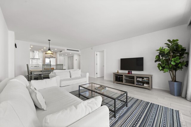 2301 Collins Ave Unit 1239, Miami Beach, FL 33139 - living area with recessed lighting, light wood-style flooring, and baseboards
