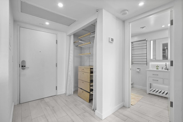 2301 Collins Ave Unit 1239, Miami Beach, FL 33139 - hallway featuring recessed lighting, baseboards, and light wood-style flooring