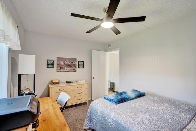 3561 Tall Pine Way Unit B-1, Greenacres, FL 33463 - carpeted bedroom featuring a textured ceiling and a ceiling fan
