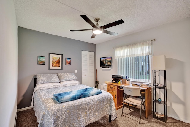 3561 Tall Pine Way Unit B-1, Greenacres, FL 33463 - carpeted bedroom featuring a desk, a closet, a textured ceiling, and ceiling fan