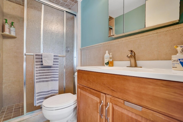 3561 Tall Pine Way Unit B-1, Greenacres, FL 33463 - full bathroom with tile walls, vanity, toilet, and a shower stall