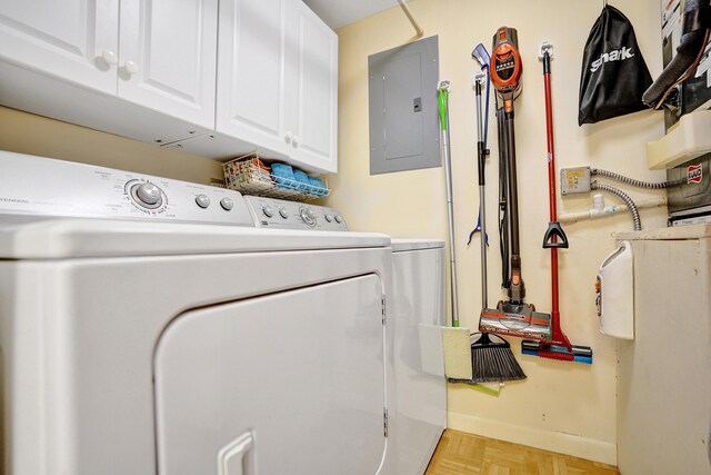 3561 Tall Pine Way Unit B-1, Greenacres, FL 33463 - washroom with electric panel, cabinet space, washer and clothes dryer, and baseboards