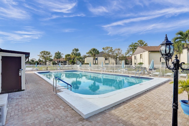 3561 Tall Pine Way Unit B-1, Greenacres, FL 33463 - community pool featuring a patio area