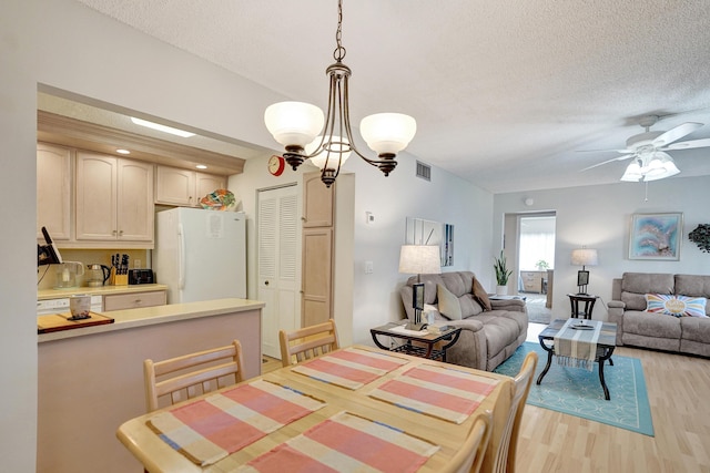 3561 Tall Pine Way Unit B-1, Greenacres, FL 33463 - dining space featuring light wood-type flooring, a textured ceiling, and a ceiling fan