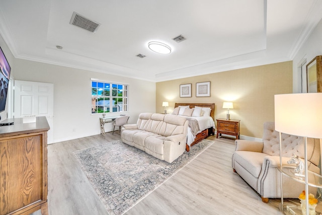1855 SW Jamesport Dr, Port Saint Lucie, FL 34953 - bedroom with a raised ceiling, light wood-style flooring, ornamental molding, and baseboards