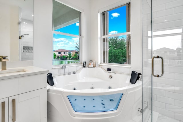 1855 SW Jamesport Dr, Port Saint Lucie, FL 34953 - full bath with a whirlpool tub, vanity, and a shower stall