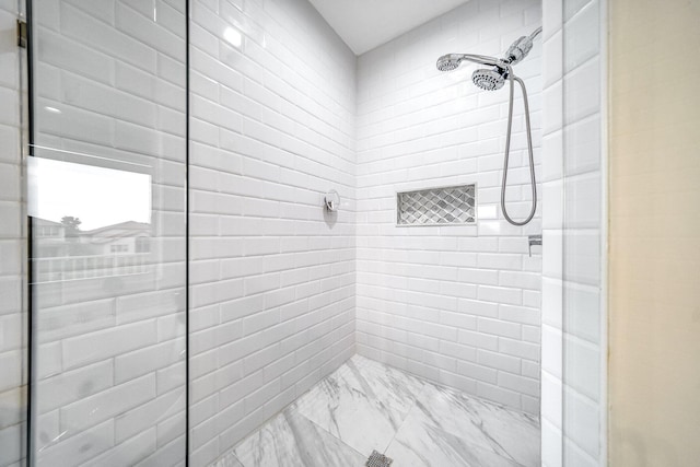 1855 SW Jamesport Dr, Port Saint Lucie, FL 34953 - bathroom featuring a tile shower and marble finish floors