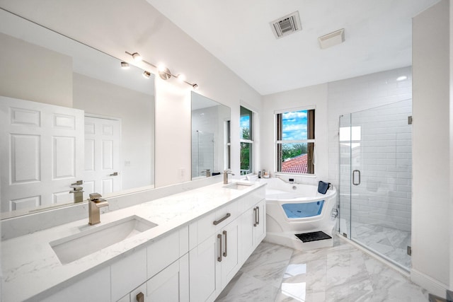 1855 SW Jamesport Dr, Port Saint Lucie, FL 34953 - full bathroom featuring a soaking tub, double vanity, a stall shower, and marble finish floors