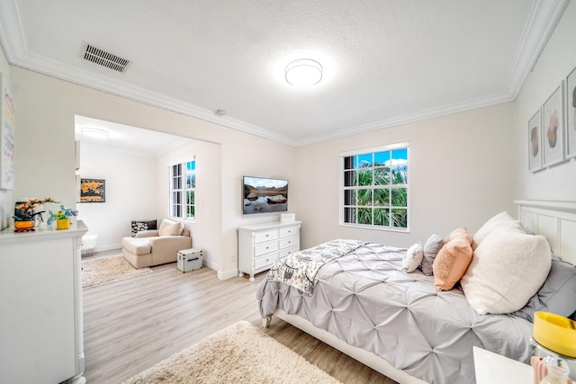 1855 SW Jamesport Dr, Port Saint Lucie, FL 34953 - bedroom with ornamental molding, light wood-style flooring, and baseboards