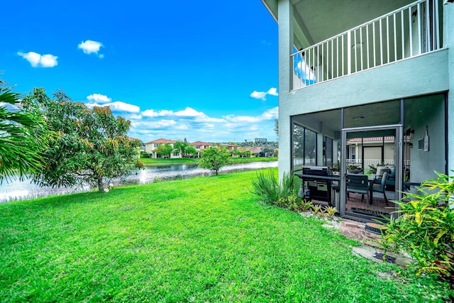 1855 SW Jamesport Dr, Port Saint Lucie, FL 34953 - view of grassy yard featuring a water view