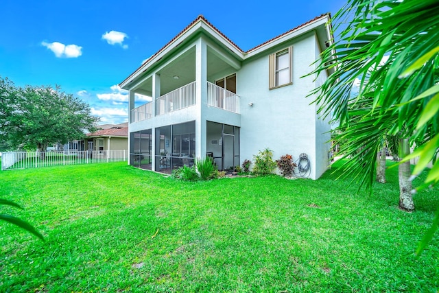 1855 SW Jamesport Dr, Port Saint Lucie, FL 34953 - back of property with a balcony, stucco siding, and a sunroom