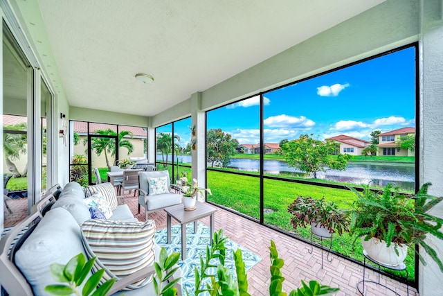 1855 SW Jamesport Dr, Port Saint Lucie, FL 34953 - sunroom featuring a water view and an outdoor living space