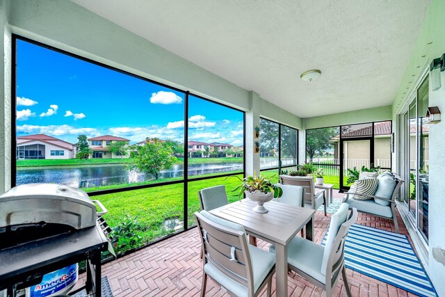 1855 SW Jamesport Dr, Port Saint Lucie, FL 34953 - sunroom / solarium featuring a water view and a residential view