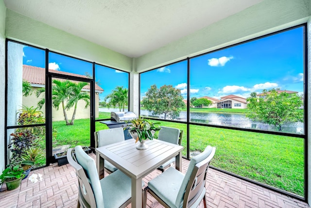 1855 SW Jamesport Dr, Port Saint Lucie, FL 34953 - sunroom / solarium featuring a water view and outdoor dining area